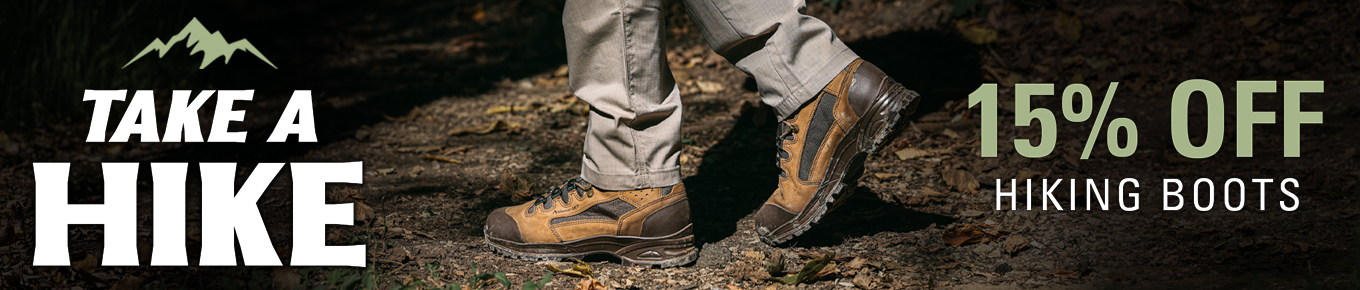 A person wearing durable HAIX hiking boots walking on a forest trail with a promotional 15 percent off sale banner.