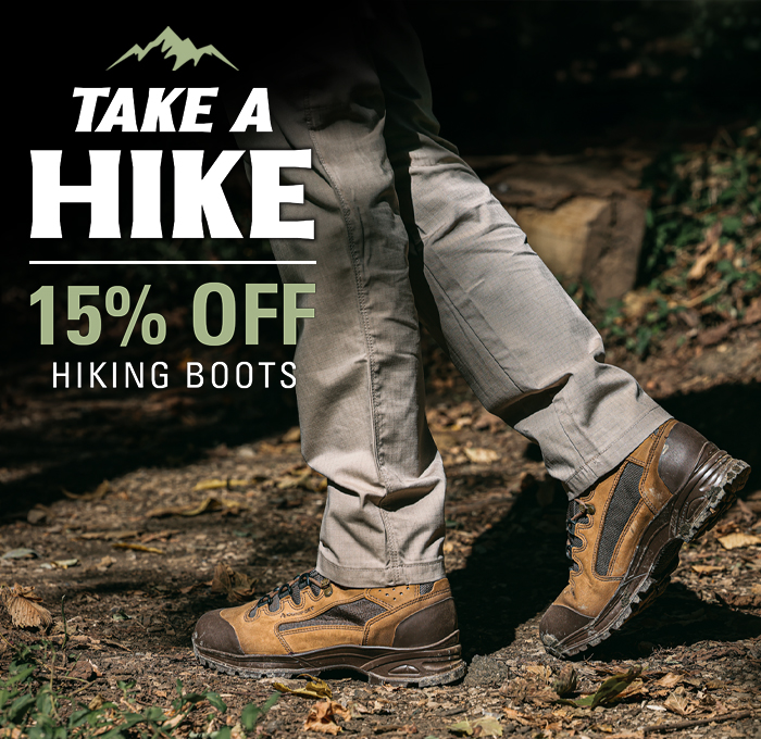A hiker wearing durable HAIX boots on a forest trail with text overlay promoting a 15 percent discount on hiking boots.